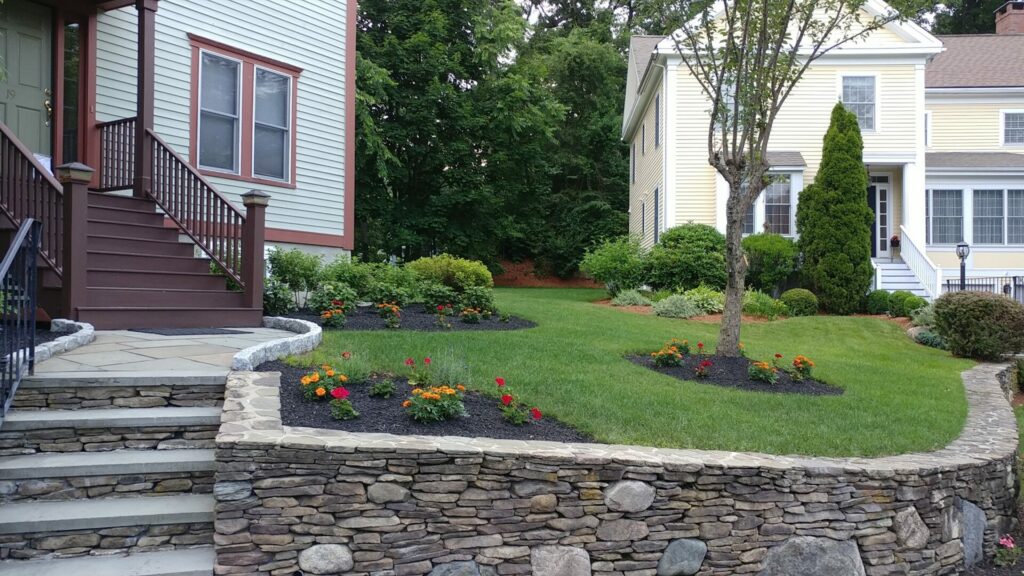natural stone retaining wall by riverfront landscape | full service landscape company