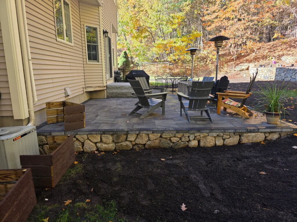 Residential backyard patio installation by Riverfront Landscape